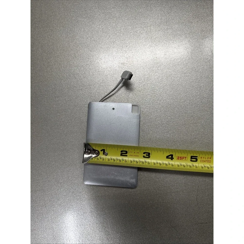 Ultra Slim portable charger silver with looks like Micro-USB cord see photos